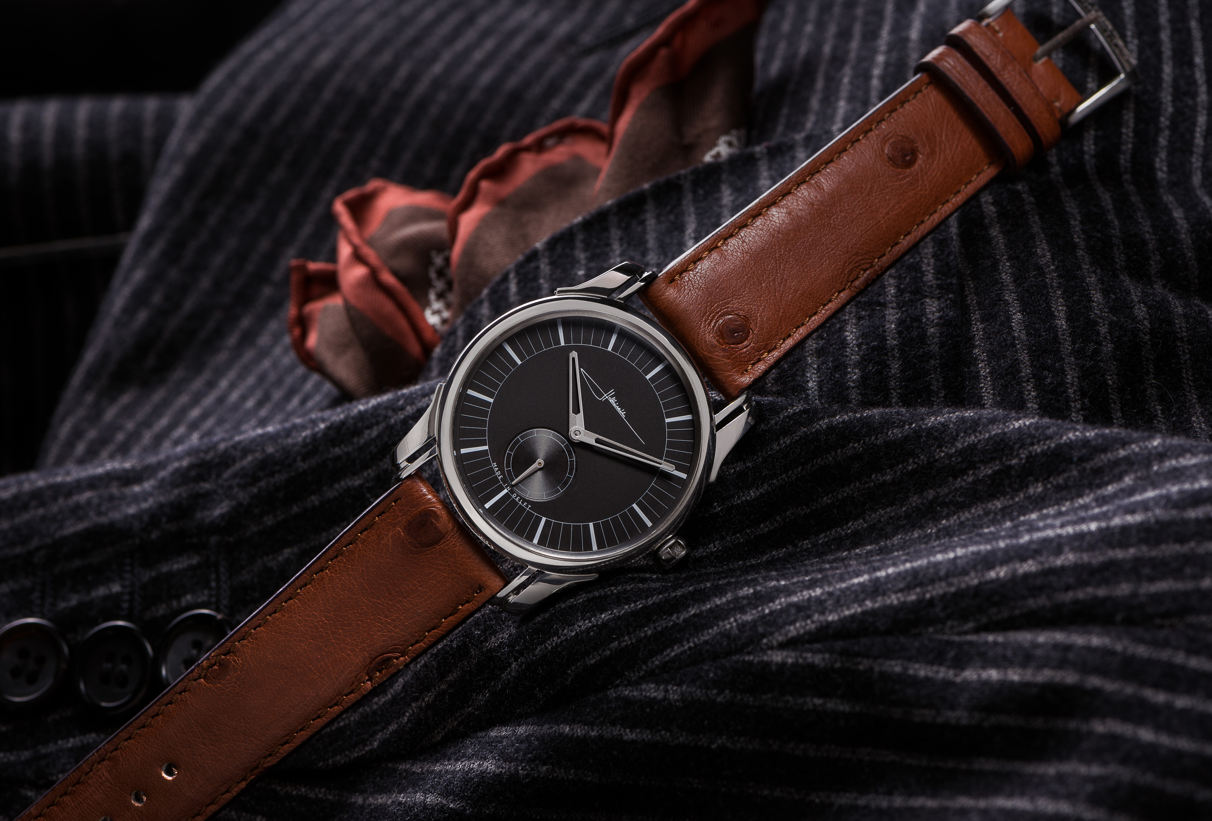 Ornament 1 wristwatch on dark fabric